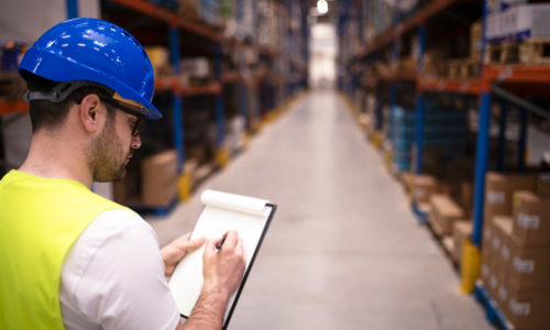 factory-worker-holding-clipboard-checking-inventory-warehouse-storage-department-new