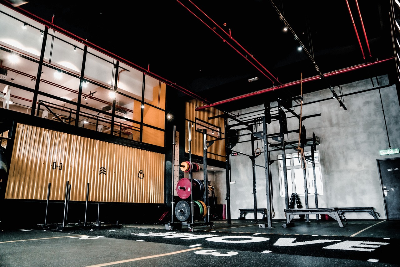 gym with a mezzanine floor